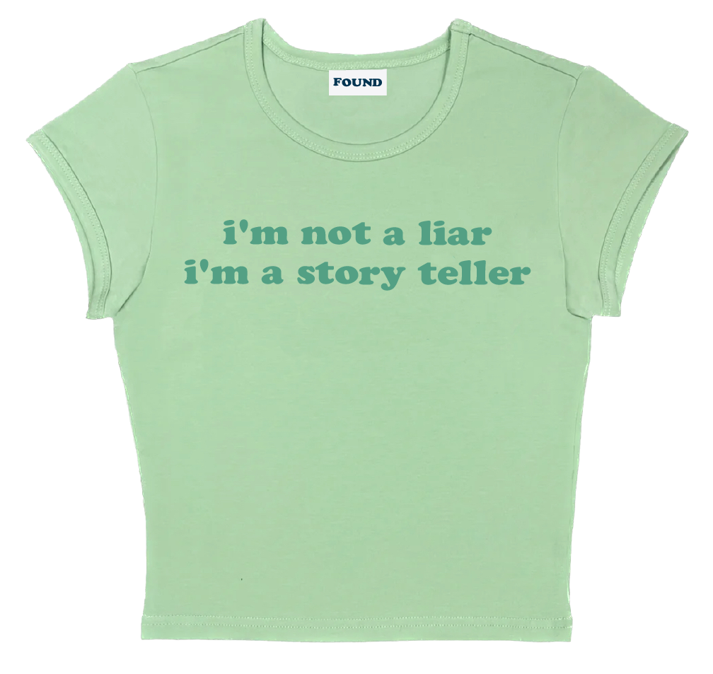 i'm not a liar i'm a story teller baby tee