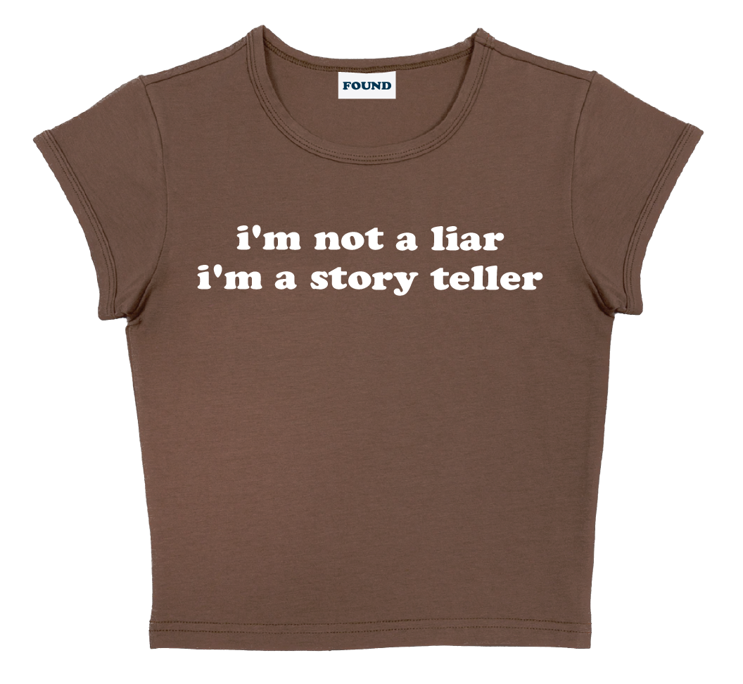 i'm not a liar i'm a story teller baby tee