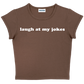 laugh at my jokes baby tee