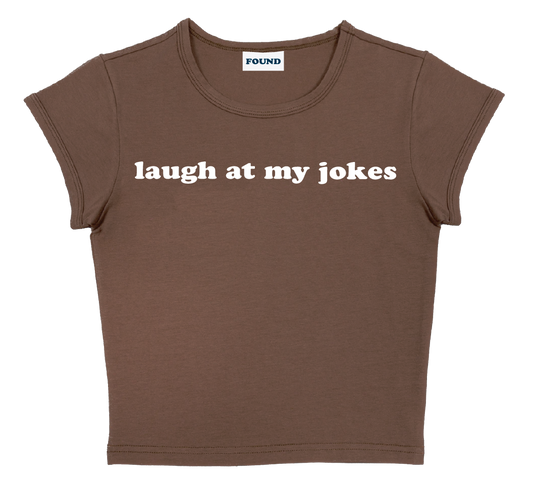 laugh at my jokes baby tee